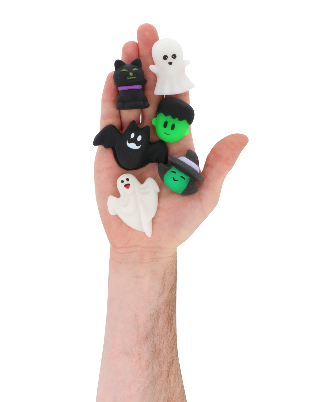 Hand holding six mini Halloween squishy toys with spooky assorted designs
