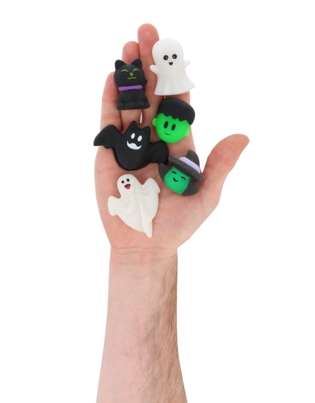 Hand holding six mini Halloween squishy toys with spooky assorted designs