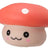 Close-up of orange kawaii squishy mushroom fidget toy with white spot and smiling face