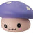 Close-up of purple kawaii squishy mushroom fidget toy with white spots and smiling face
