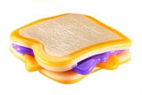 Mushmeez peanut butter and jelly sandwich taba squishy showing layered yellow, white and purple compound