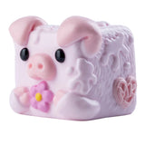 MushyKinz Bubbles the Pig taba squishy, pink sensory fidget toy holding purple flower