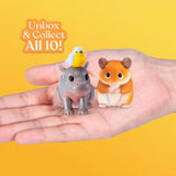 Hand holding My Mini Pets miniature hippo with yellow bird and flocked hamster figures