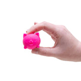 Hand holding the pink Cuddles Nee Doh Cool Cat squishy between thumb and fingers