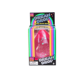 Pink Nee Doh Dream Drop glitter squishy displayed in its rainbow striped retail box