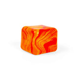Orange and red marbled Nee Doh Nice Cube Swirl on a white background