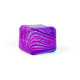 Purple and pink marbled Nee Doh Nice Cube Swirl on a white background