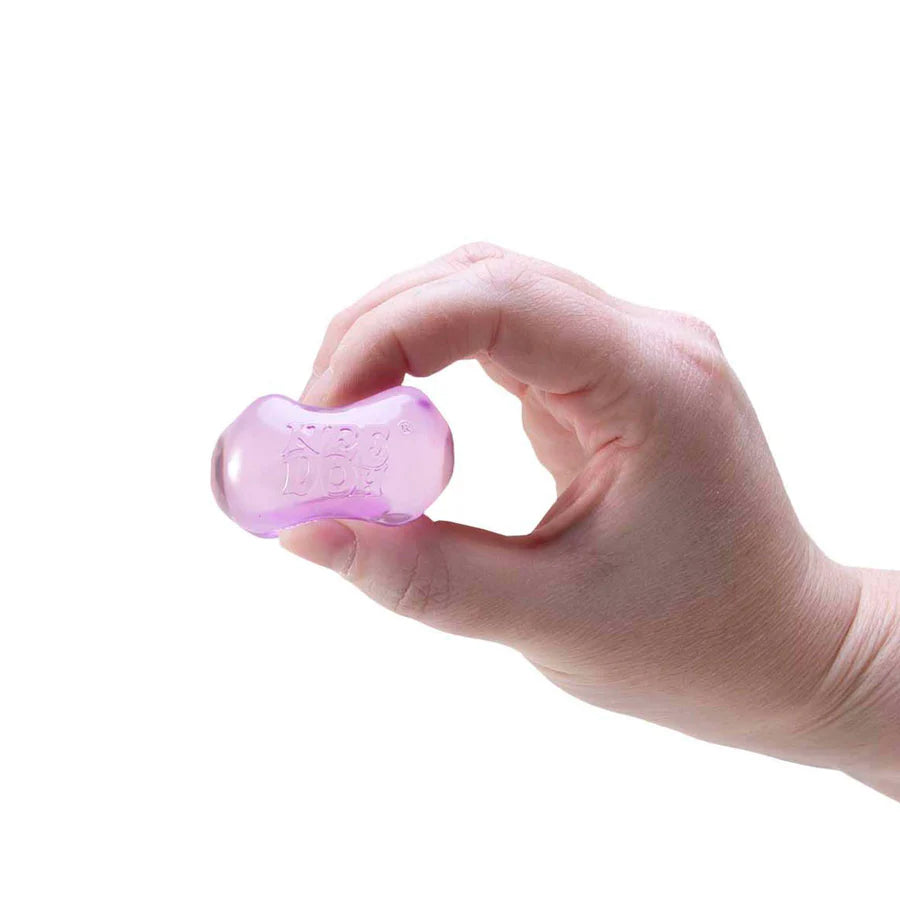 Hand holding a translucent purple Nee Doh Nice Ice Baby squishy cube between thumb and fingers