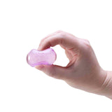 Hand holding a translucent purple Nee Doh Nice Ice Baby squishy cube between thumb and fingers