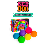 Six rainbow-coloured Nee Doh Teenie squish balls arranged in front of their retro rainbow gift box