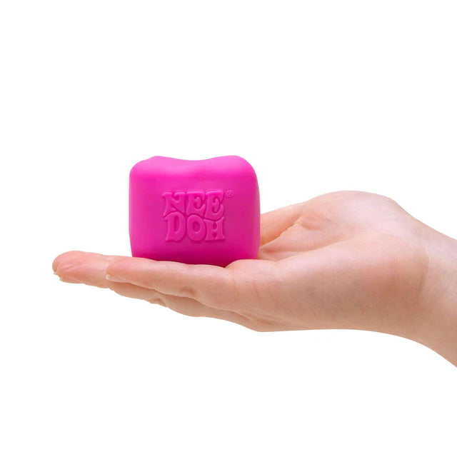 Pink NeeDoh Colour Change Cube held in hand, fidget sensory toy