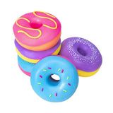 Five NeeDoh Dohnuts in pink, purple and blue arranged in a stack and laid flat