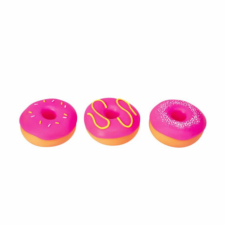Three pink NeeDoh Dohnuts showing sprinkle, drizzle and pearl frosting designs