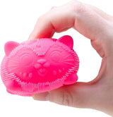 Nee Doh Fuzz Ball Wild Cats pink squishy cat sensory fidget toy held in hand