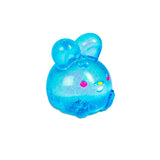 Close-up of blue glitter NeeDoh Jelly Hops squish bunny with colourful dot facial details