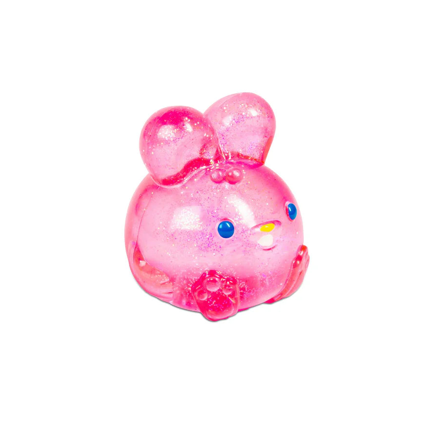 Close-up of pink glitter NeeDoh Jelly Hops squish bunny showing sparkle texture and paw details