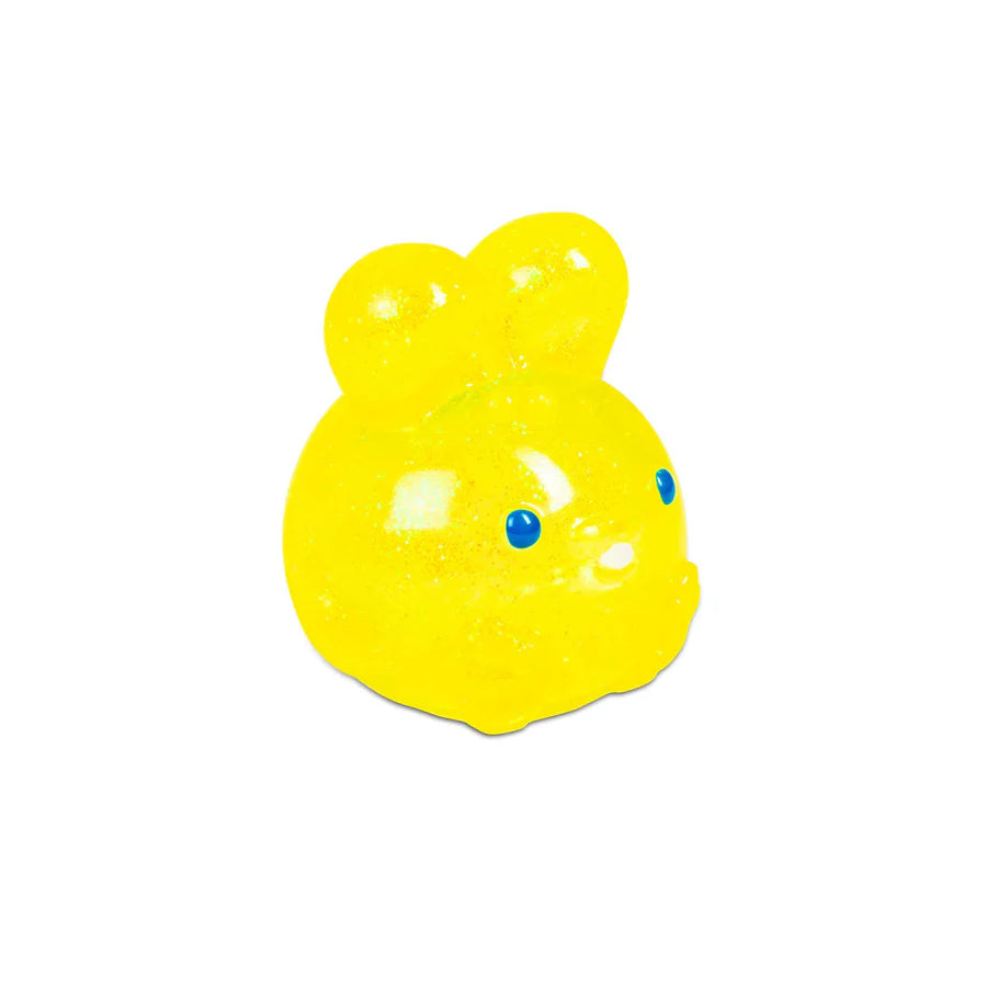 Close-up of yellow glitter NeeDoh Jelly Hops squish bunny with blue dot eyes