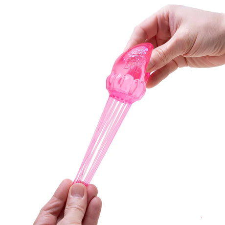 Pink NeeDoh Jelly Squish jellyfish tentacles being stretched between two hands