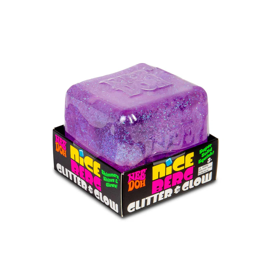 Purple Nee Doh Nice Berg Glitter and Glow squish cube sitting on top of its branded retail box