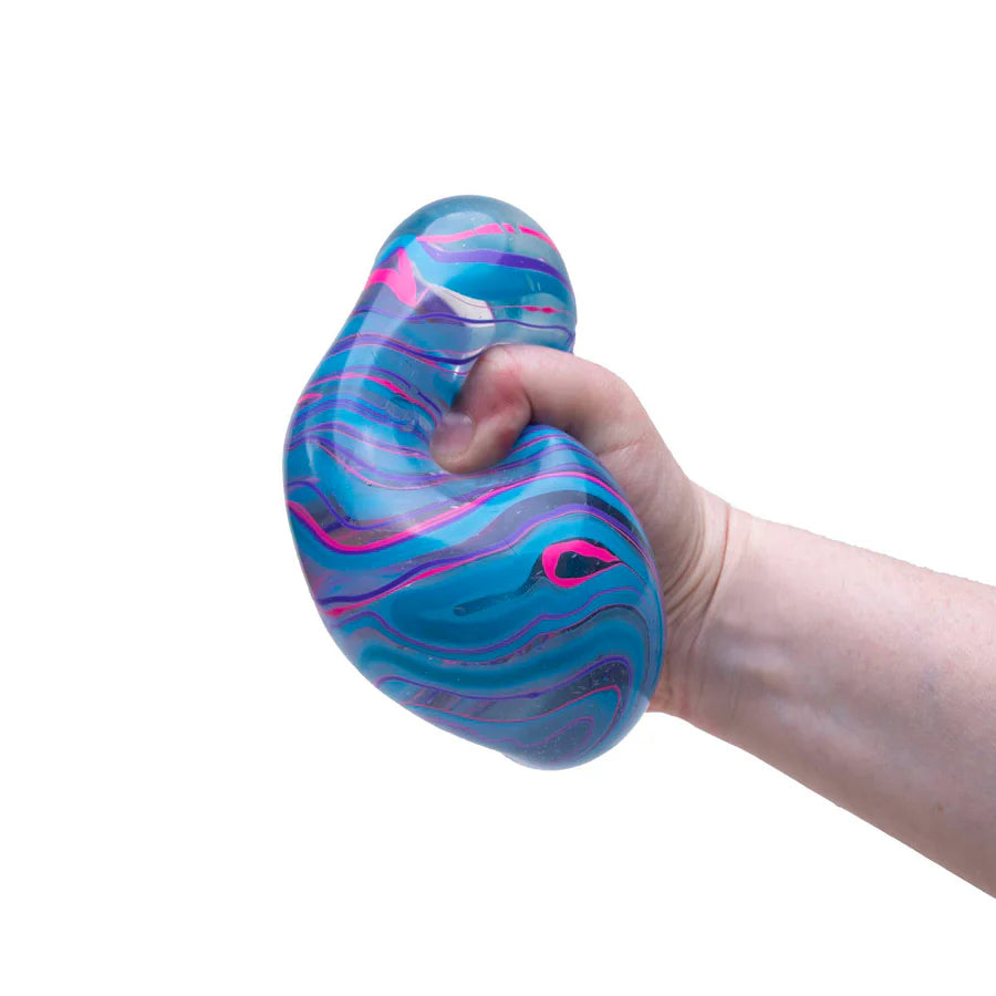Hand squeezing blue and pink marbled Nee Doh Nice Berg Swirl showing deformation and swirl movement