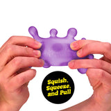 Two hands squishing and pulling a purple NeeDoh Sploot Splat