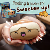 Person holding the Nice Buns kawaii cinnamon roll squishy in both hands