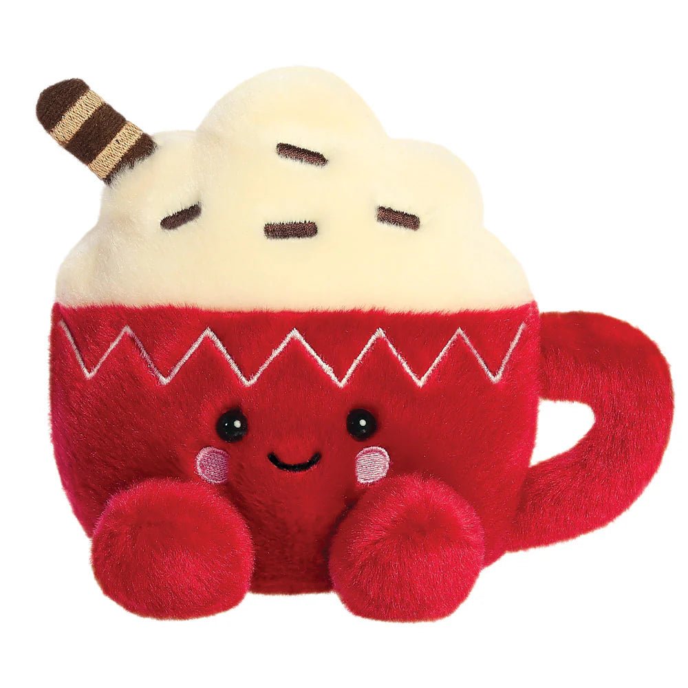 Palm Pals Cassia Hot Cocoa plush, a small palm-sized stuffed red mug character with a cream whipped topping, chocolate sprinkles, a striped wafer straw, a zigzag white embroidered pattern on the mug, and a smiling face with pink cheeks