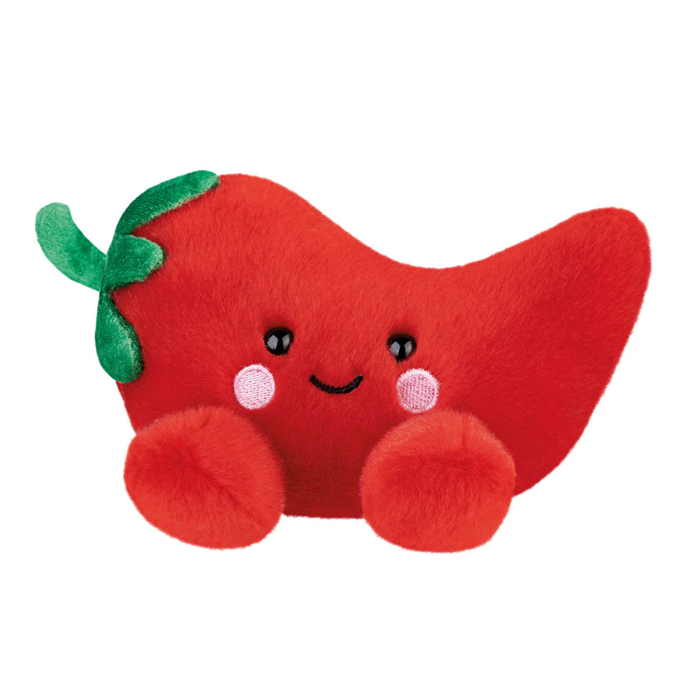Red plush toy with a smiling face on a white background