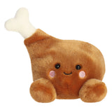 Plush toy shaped like a chicken leg with a smiling face on a white background