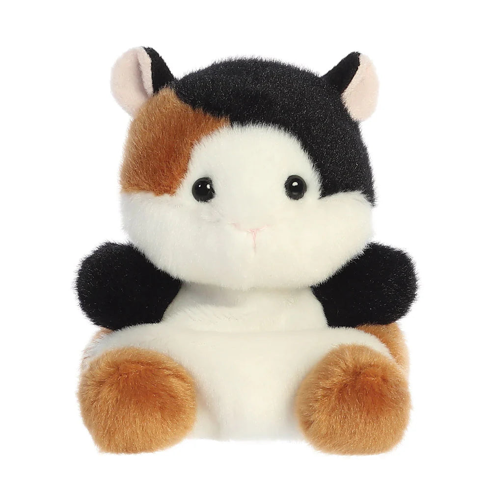 Palm Pals Nutmeg Guinea Pig plush, a small palm-sized stuffed guinea pig with black, tan, and white patched colouring, a white muzzle, and a tiny pink embroidered nose