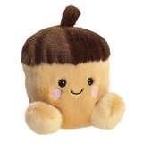 Palm Pals Oak Acorn plush, a small palm-sized stuffed acorn with a tan body, a dark brown textured acorn cap with a small brown stalk on top, pink rosy cheeks, and a gentle smile