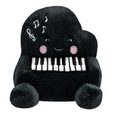 Aurora Palm Pals Paul Piano plush — a black grand piano-shaped soft toy with embroidered white and black keys, musical note details, pink blush cheeks, and a smiling face