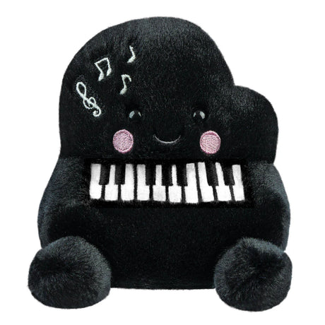 Aurora Palm Pals Paul Piano plush — a black grand piano-shaped soft toy with embroidered white and black keys, musical note details, pink blush cheeks, and a smiling face