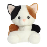Palm Pals Peebs Calico Cat plush, a small palm-sized stuffed calico cat with black, tan, and white patched colouring, a white face, and tan rounded feet