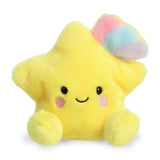 Aurora Palm Pals Pisces Shooting Star plush — a bright yellow star-shaped soft toy with a pastel rainbow tuft of pink, blue, and purple on top, pink blush cheeks, and a cheerful smiling face