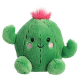 Aurora Palm Pals cactus plush — a round green cactus soft toy with embroidered ridges, small side arms, a bright pink fluffy tuft on top, and a cheerful smiling face