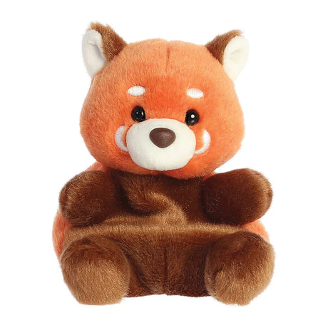 Aurora Palm Pals Rei Red Panda plush — a vibrant orange and dark brown red panda soft toy with white-tipped ears, white facial markings around the eyes, and a wide smiling muzzle