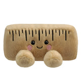 Aurora Palm Pals Roman Ruler plush — a tan rectangular ruler-shaped soft toy with embroidered measurement markings, pink blush cheeks, and a smiling face, sitting against a white background