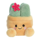 Aurora Palm Pals Seyla Succulent plush — a sandy yellow square pot soft toy with a sage green succulent plant on top decorated with a small red embroidered flower, pink cheeks, and a smiling face