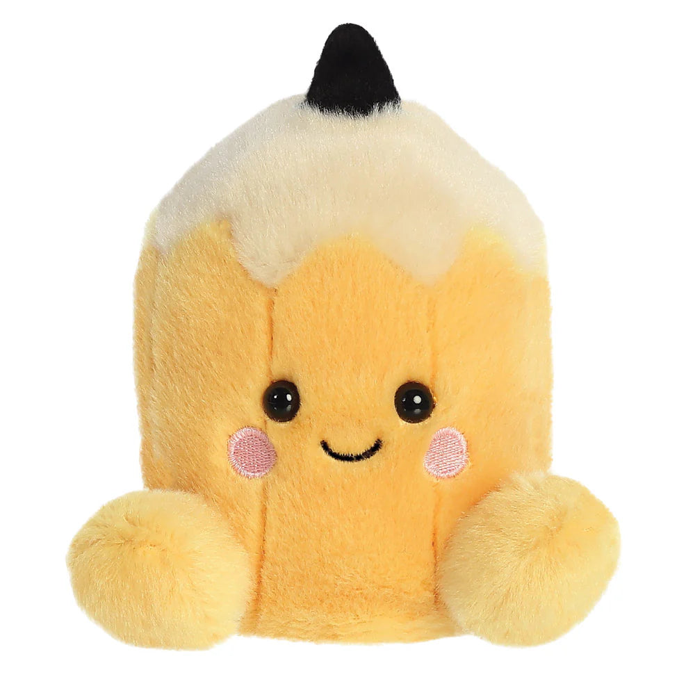 Aurora Palm Pals Tike Pencil plush — a yellow pencil-shaped soft toy with a cream and black tip, pink blush cheeks, a smiling face, and rounded yellow feet