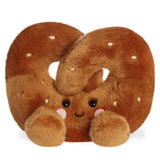 Plush toy shaped like a pretzel on a white background