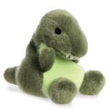 Palm Pals Tyranno Rex plush, a small palm-sized stuffed T-rex with a dark olive green body, pale lime green belly, white embroidered teeth, and a tiny black bead eye