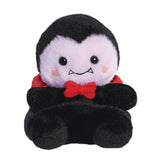 Plush toy of a vampire character with a red bow tie on a white background