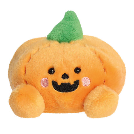 Plush pumpkin toy with a smiling face on a white background