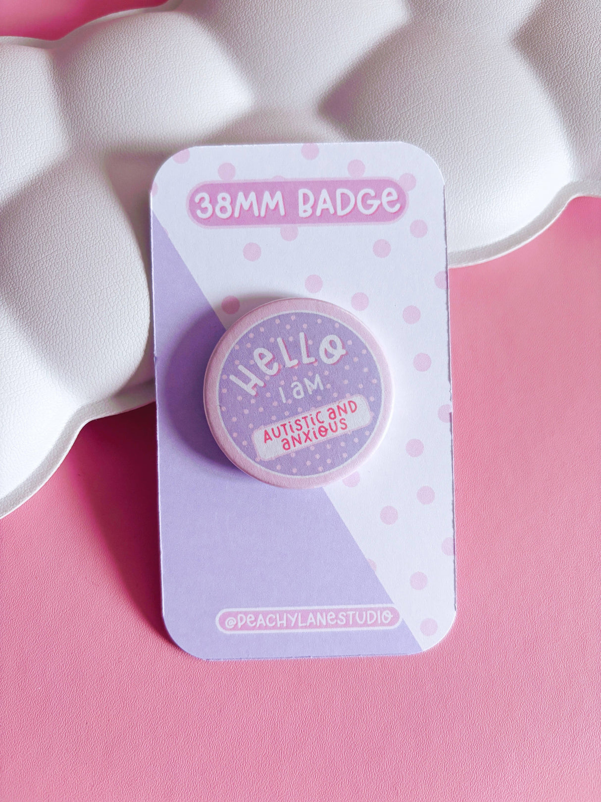 Peachy Lane Studio Hello I Am Autistic and Anxious 38mm badge, lilac, pink background