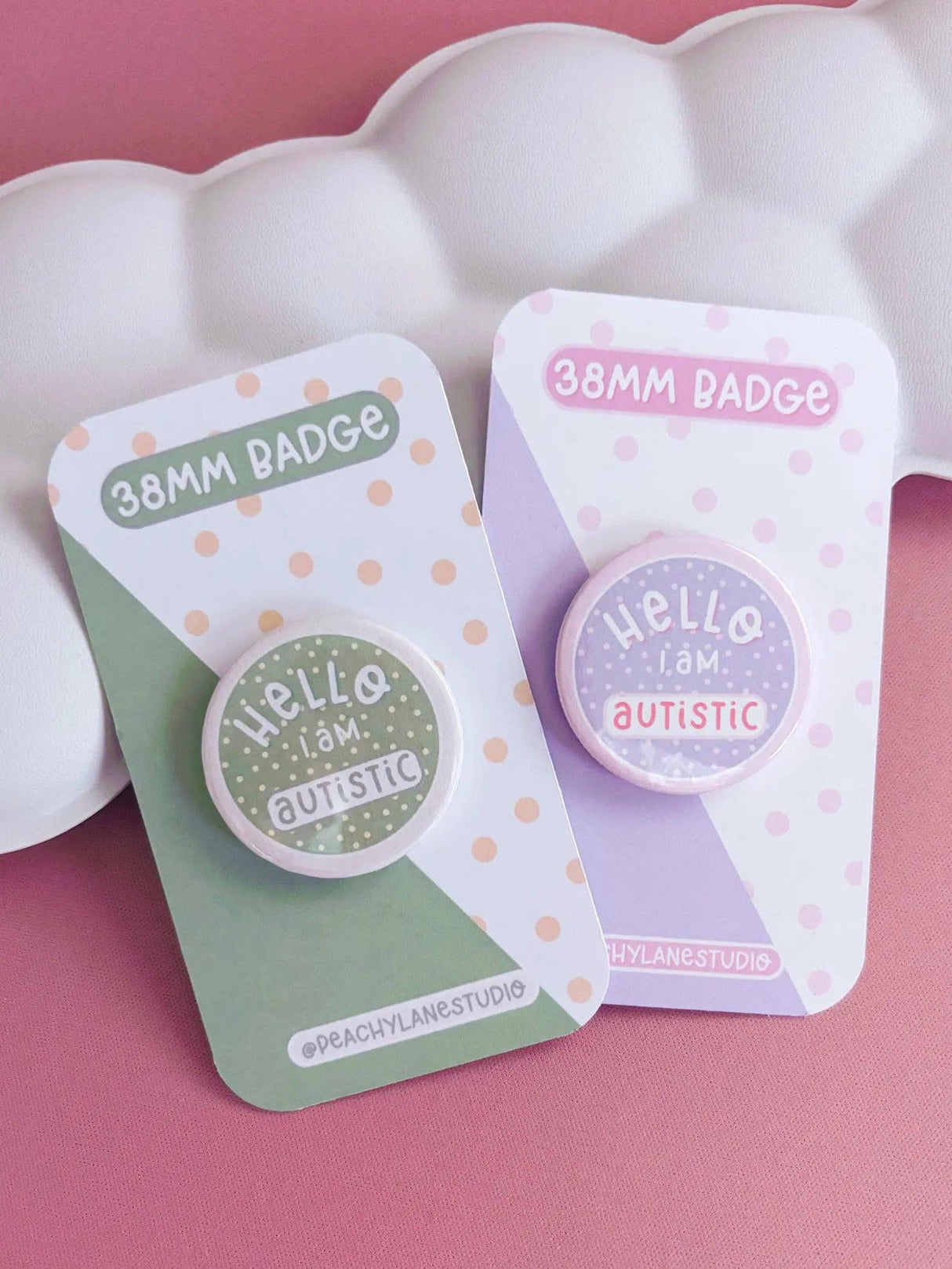Peachy Lane Studio Hello I Am Autistic badge, sage green and lilac variants flat lay
