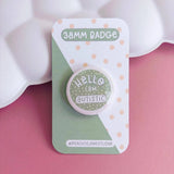 Peachy Lane Studio Hello I Am Autistic badge, sage green, on pink background