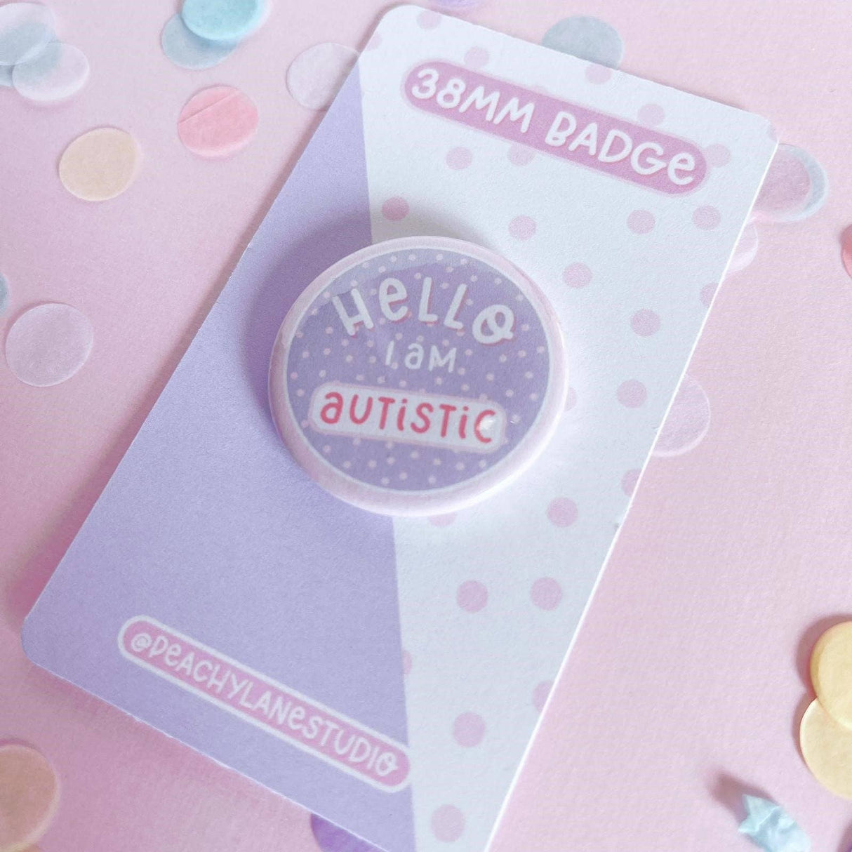 Peachy Lane Studio Hello I Am Autistic badge, lilac, angled on backing card