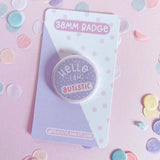 Peachy Lane Studio Hello I Am Autistic 38mm badge, lilac, with confetti background