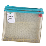 Petra Boase pale mesh handy bag with teal zip shown flat against white background with Handy Bag tag
